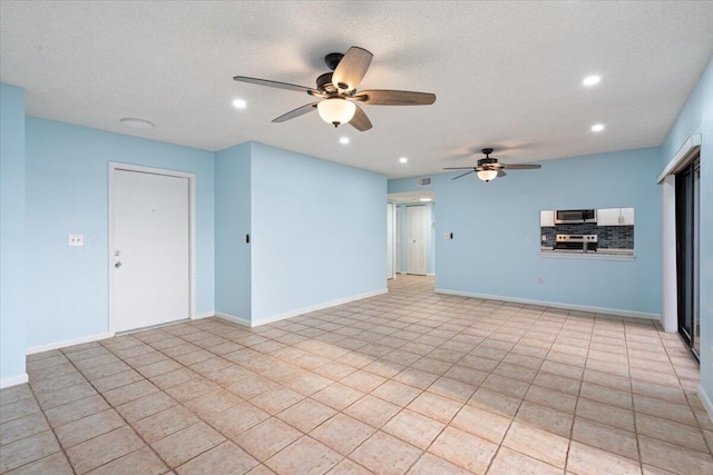 unfurnished living room featuring a ceiling fan, recessed lighting, and baseboards