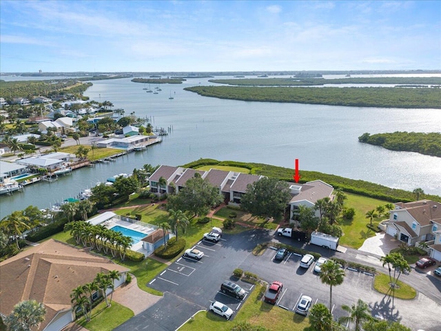 aerial view of residential area with a large body of water