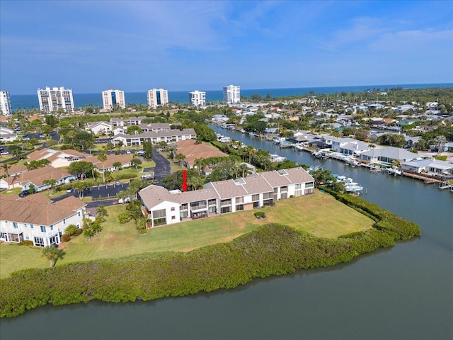 aerial perspective of suburban area with a large body of water