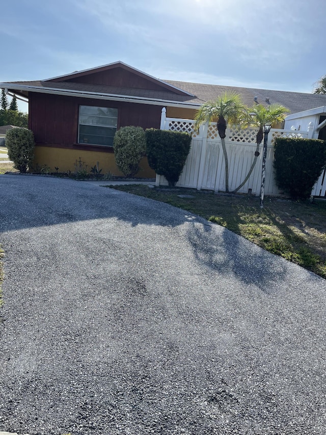 view of side of property with fence
