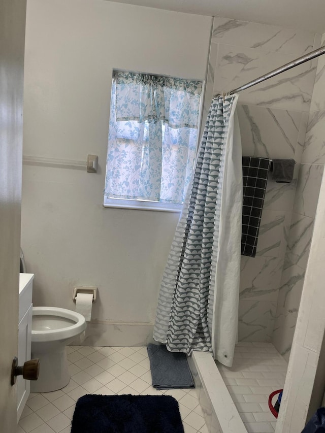 bathroom featuring a stall shower, toilet, tile patterned floors, and vanity