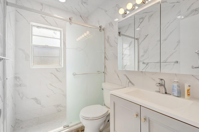 bathroom with toilet, a marble finish shower, vanity, and tile walls
