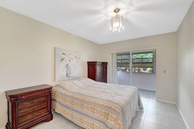 bedroom with light tile patterned floors and baseboards