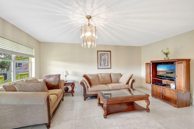living area featuring a chandelier and light tile patterned flooring