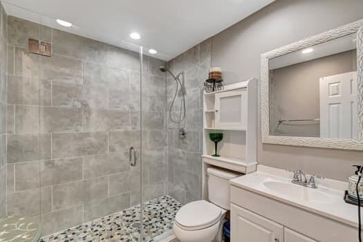 701 SW 1st Ave S, Boynton Beach, FL 33426 - full bath with a shower stall, toilet, recessed lighting, and vanity