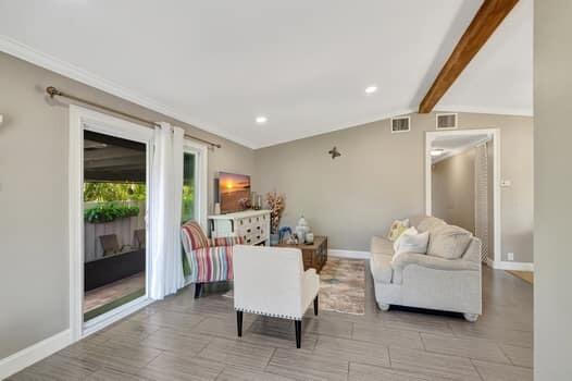 701 SW 1st Ave S, Boynton Beach, FL 33426 - living area with baseboards, beam ceiling, and recessed lighting