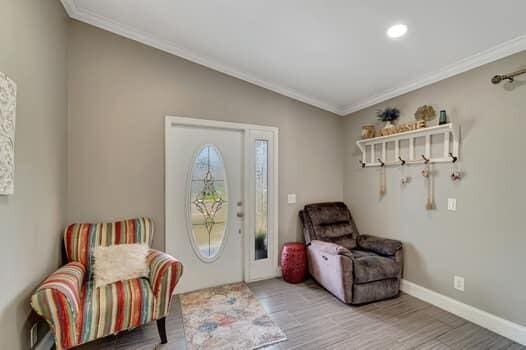 701 SW 1st Ave S, Boynton Beach, FL 33426 - living area with ornamental molding, wood finished floors, baseboards, recessed lighting, and lofted ceiling