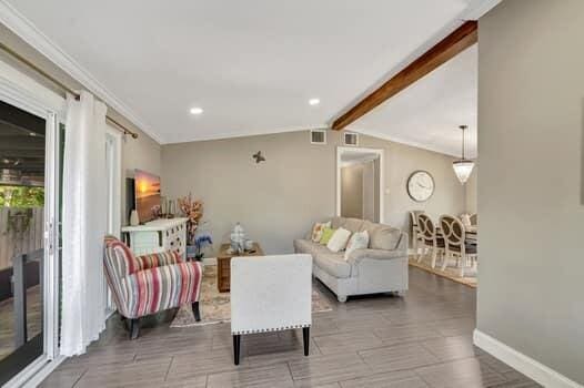 701 SW 1st Ave S, Boynton Beach, FL 33426 - living room with baseboards, crown molding, and recessed lighting
