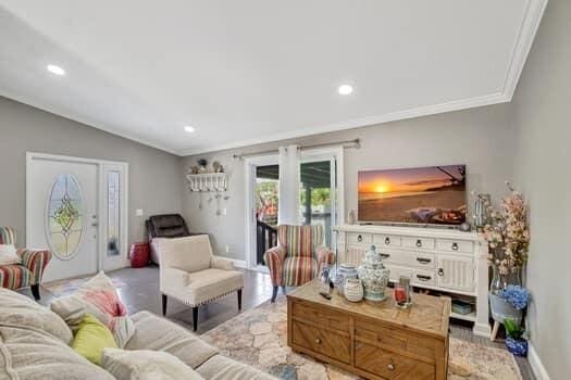 701 SW 1st Ave S, Boynton Beach, FL 33426 - living area with ornamental molding, lofted ceiling, baseboards, and recessed lighting