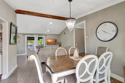 701 SW 1st Ave S, Boynton Beach, FL 33426 - dining area with a chandelier, baseboards, crown molding, and recessed lighting