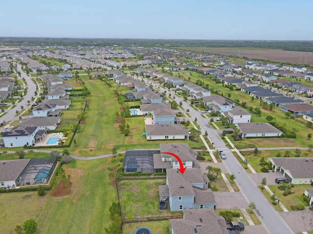aerial view of property's location with nearby suburban area