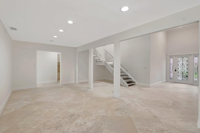 basement with stairway, recessed lighting, and baseboards