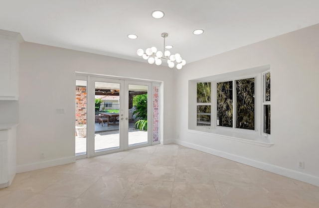 unfurnished dining area featuring recessed lighting, french doors, baseboards, and a chandelier