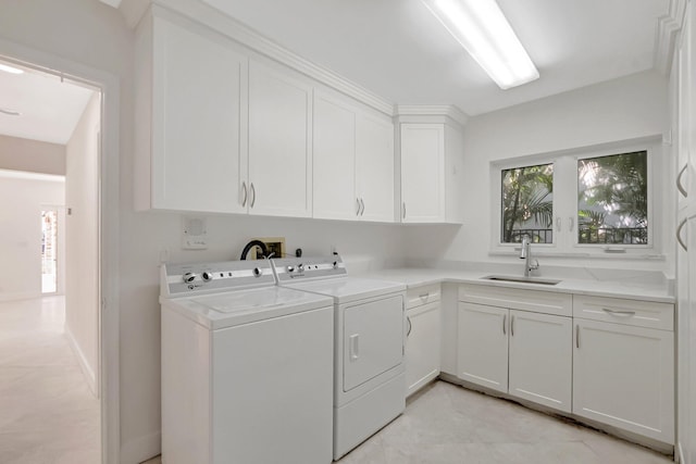laundry room featuring cabinet space and separate washer and dryer
