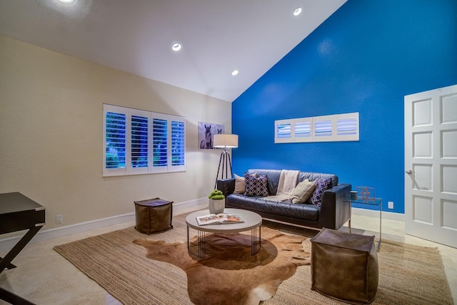 living area with recessed lighting, baseboards, and high vaulted ceiling