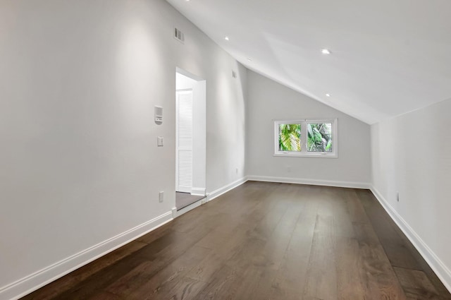 bonus room featuring lofted ceiling, dark wood-type flooring, baseboards, and recessed lighting