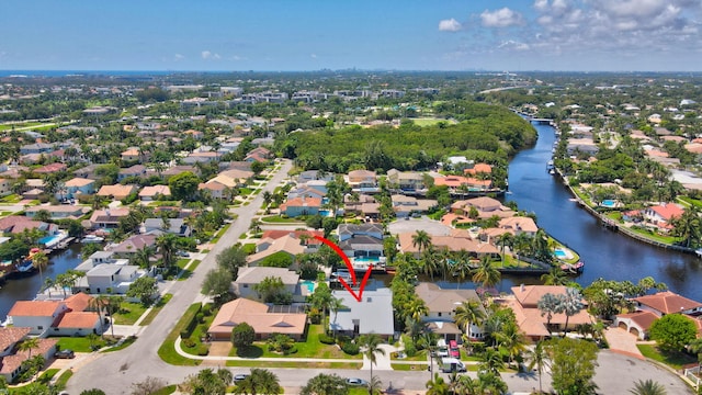 aerial overview of property's location featuring nearby suburban area and a large body of water