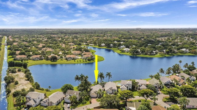 aerial view of residential area with a nearby body of water