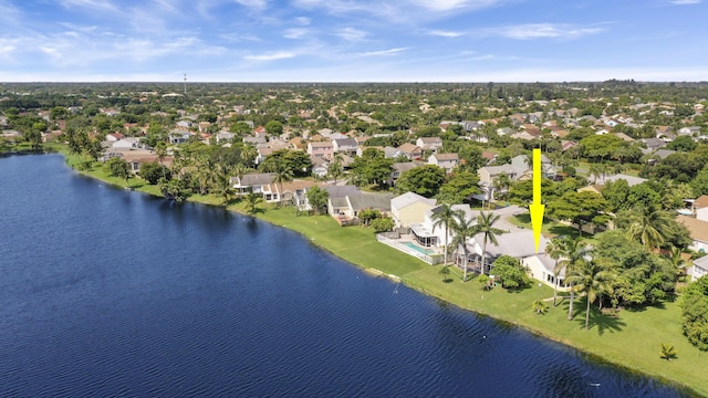 aerial view of residential area featuring a nearby body of water