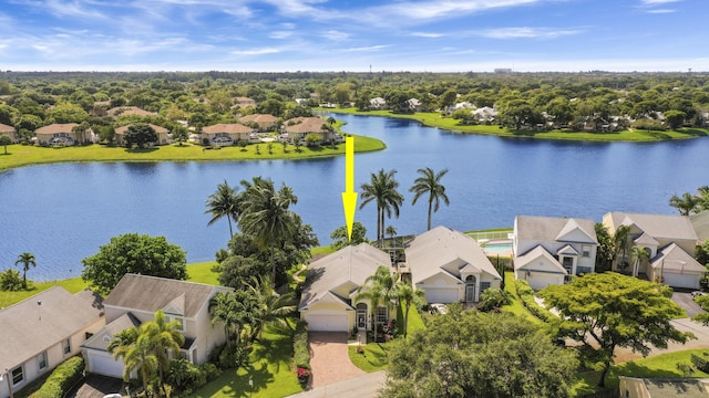 aerial view of residential area with a large body of water