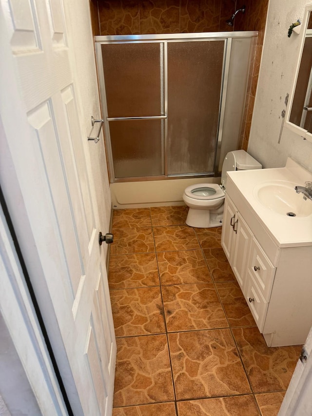 4420 NW 34th St, Lauderdale Lakes, FL 33319 - bathroom featuring toilet, vanity, and shower / bath combination with glass door