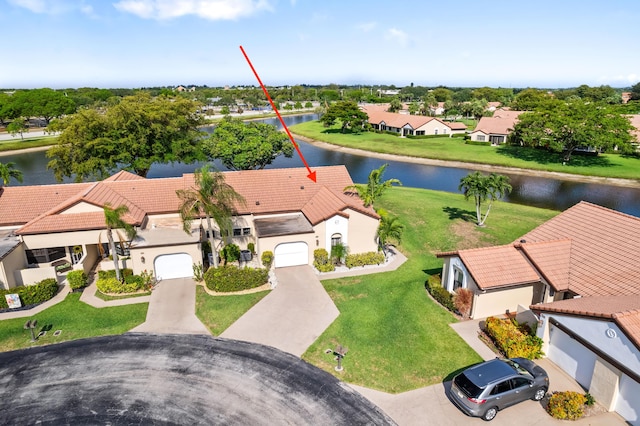 aerial view of residential area with a nearby body of water