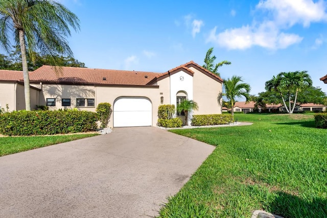 mediterranean / spanish-style house featuring a tile roof, a garage, a front yard, stucco siding, and driveway