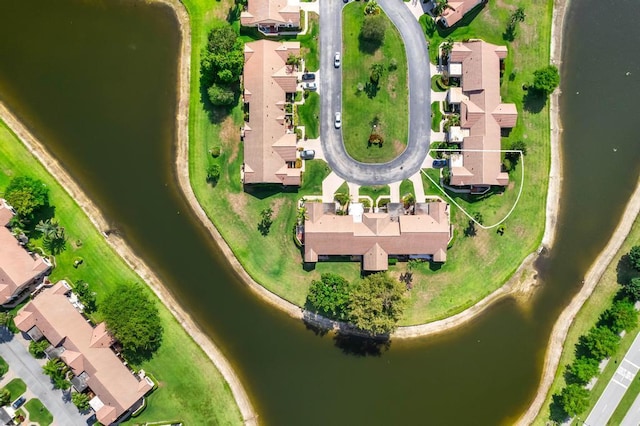 aerial overview of property's location featuring nearby suburban area and a nearby body of water