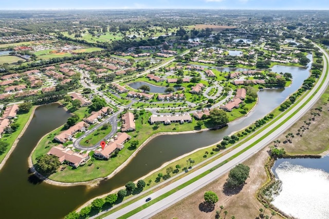 view of property location featuring nearby suburban area and a nearby body of water