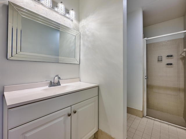151 Meadows Dr, Boynton Beach, FL 33436 - bathroom featuring a stall shower, vanity, and tile patterned floors