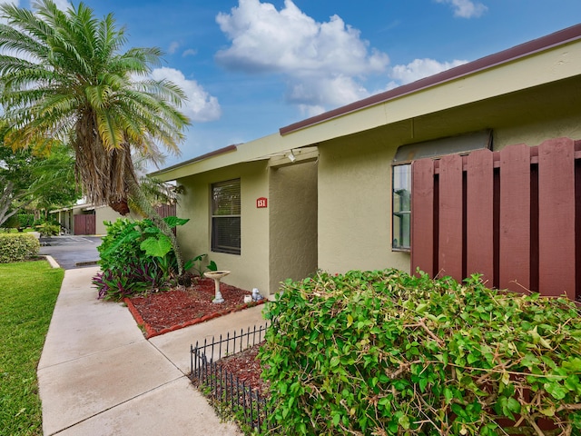 151 Meadows Dr, Boynton Beach, FL 33436 - property entrance with stucco siding