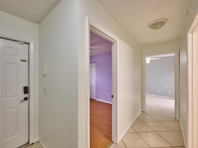 151 Meadows Dr, Boynton Beach, FL 33436 - corridor featuring baseboards and light tile patterned floors