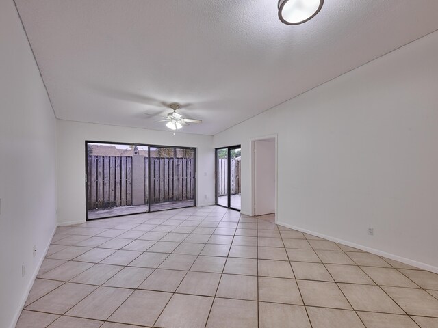 151 Meadows Dr, Boynton Beach, FL 33436 - unfurnished room with a ceiling fan, baseboards, and light tile patterned floors