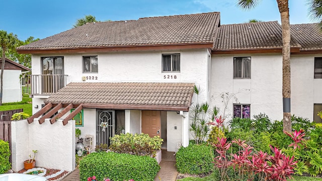 5218 Fountains Dr S Unit 206, Lake Worth, FL 33467 - back of property featuring a tile roof and stucco siding