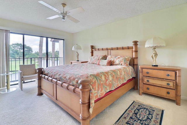 5218 Fountains Dr S Unit 206, Lake Worth, FL 33467 - bedroom featuring light carpet, access to outside, a textured ceiling, and a ceiling fan