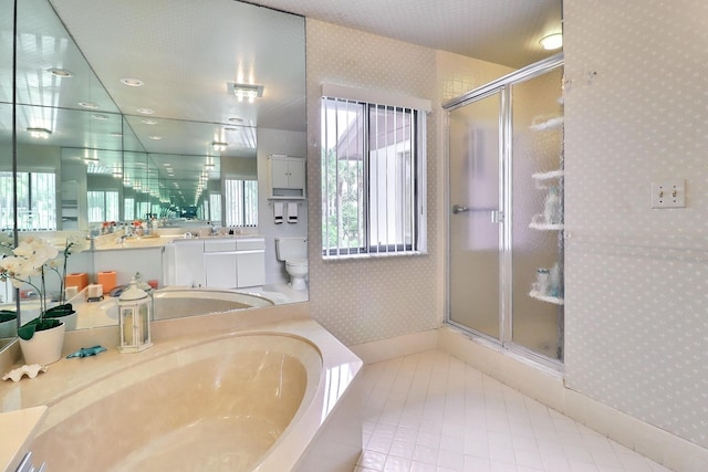 5218 Fountains Dr S Unit 206, Lake Worth, FL 33467 - full bathroom with wallpapered walls, a shower stall, vanity, a bath, and baseboards