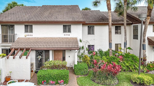 5218 Fountains Dr S Unit 206, Lake Worth, FL 33467 - view of front of house with a tile roof and stucco siding