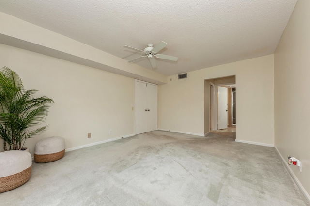 10173 Mangrove Dr Unit 204, Boynton Beach, FL 33437 - unfurnished room with ceiling fan, light carpet, baseboards, and a textured ceiling