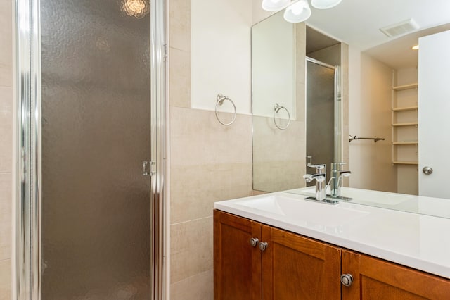 10173 Mangrove Dr Unit 204, Boynton Beach, FL 33437 - full bath featuring a stall shower, vanity, and tile walls