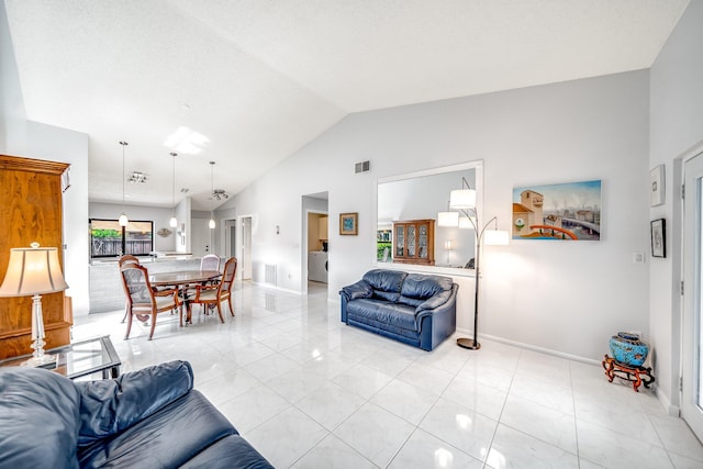 8735 Boca Glades Blvd W Unit D, Boca Raton, FL 33434 - living area featuring lofted ceiling, baseboards, and light tile patterned floors