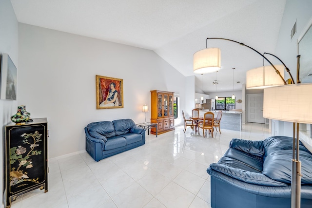 8735 Boca Glades Blvd W Unit D, Boca Raton, FL 33434 - living room featuring lofted ceiling, light tile patterned floors, and baseboards