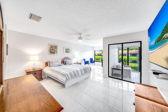 8735 Boca Glades Blvd W Unit D, Boca Raton, FL 33434 - bedroom featuring access to outside, light tile patterned floors, a textured ceiling, and ceiling fan