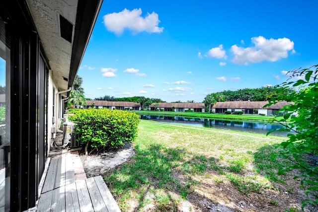 8735 Boca Glades Blvd W Unit D, Boca Raton, FL 33434 - view of green lawn featuring a water view and a residential view