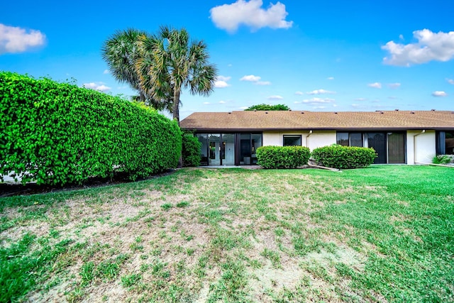 8735 Boca Glades Blvd W Unit D, Boca Raton, FL 33434 - back of house featuring a lawn, a sunroom, and stucco siding