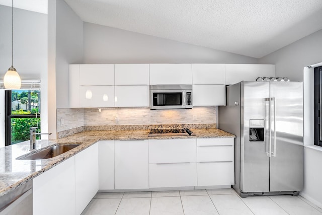 8735 Boca Glades Blvd W Unit D, Boca Raton, FL 33434 - kitchen with appliances with stainless steel finishes, lofted ceiling, a sink, decorative backsplash, and white cabinetry