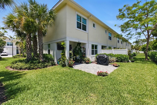 622 Parsons Way, Deerfield Beach, FL 33442 - rear view of house with stucco siding and a patio