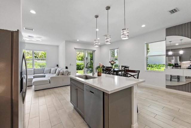 622 Parsons Way, Deerfield Beach, FL 33442 - kitchen featuring stainless steel appliances, a sink, open floor plan, wood finish floors, and recessed lighting