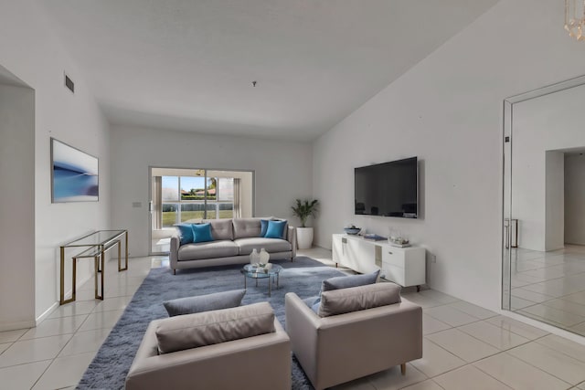 5952 Regal Glen Dr Unit 204, Boynton Beach, FL 33437 - living area featuring light tile patterned floors and lofted ceiling