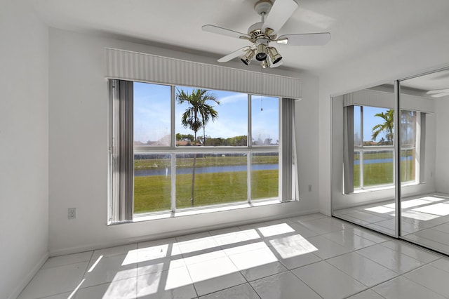 5952 Regal Glen Dr Unit 204, Boynton Beach, FL 33437 - spare room with plenty of natural light, a water view, and ceiling fan