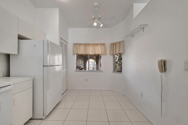 5952 Regal Glen Dr Unit 204, Boynton Beach, FL 33437 - kitchen with a ceiling fan, stove, light countertops, freestanding refrigerator, and white cabinetry